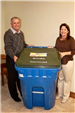 Mary Delapasse and Parish President Riley pose with new recycle carts