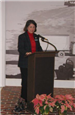Woman speaking at a podium