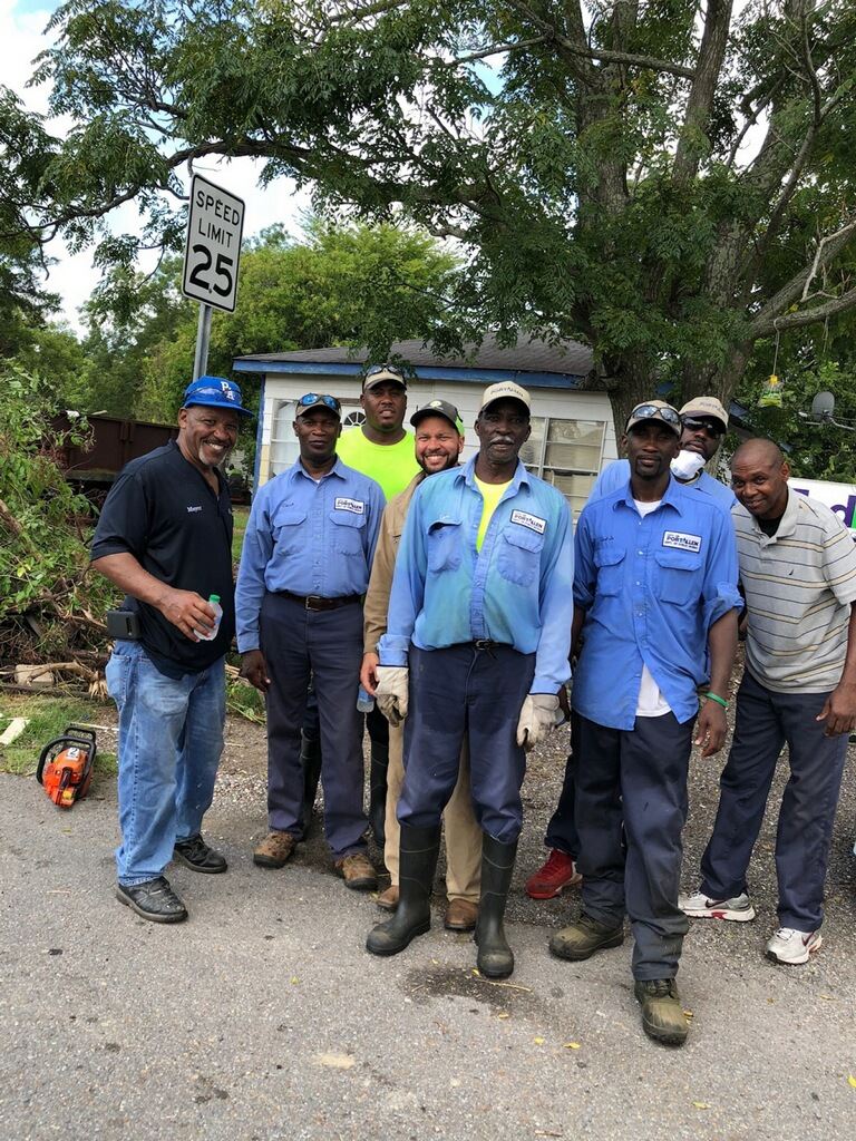 Downtown Clean Up Group Cutting Down Branches