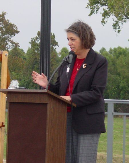 Woman speaking during the dedication
